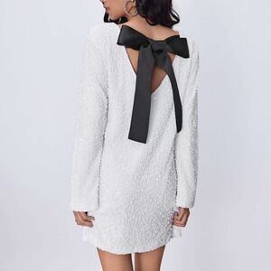 Elegant White Dress with Black Bow